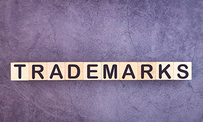 wooden letters spelling the word trademarks